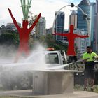 man cleaning a Barbecue in brisbane