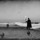 Man in Black at the Beach with Balloons and Spheres #2