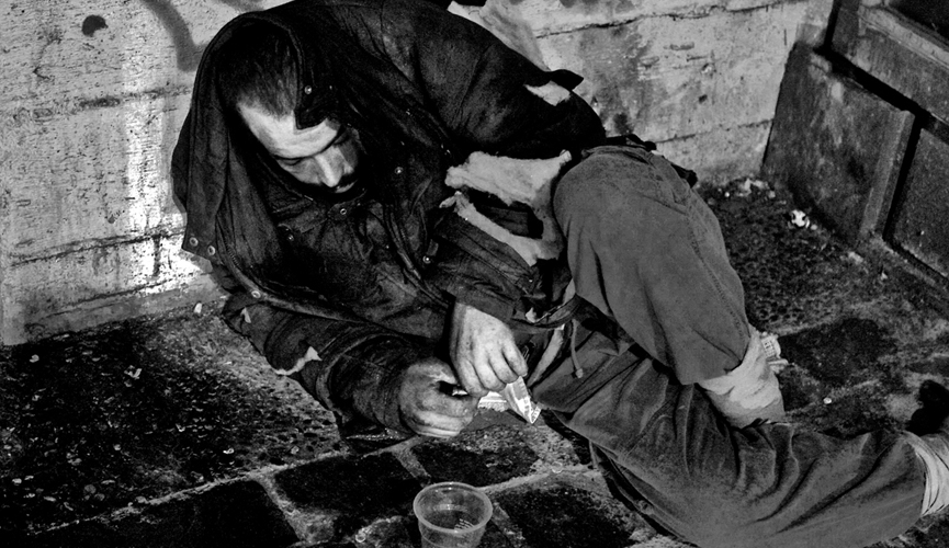 Man is reposes on the street of athen