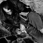 Man is reposes on the street of athen