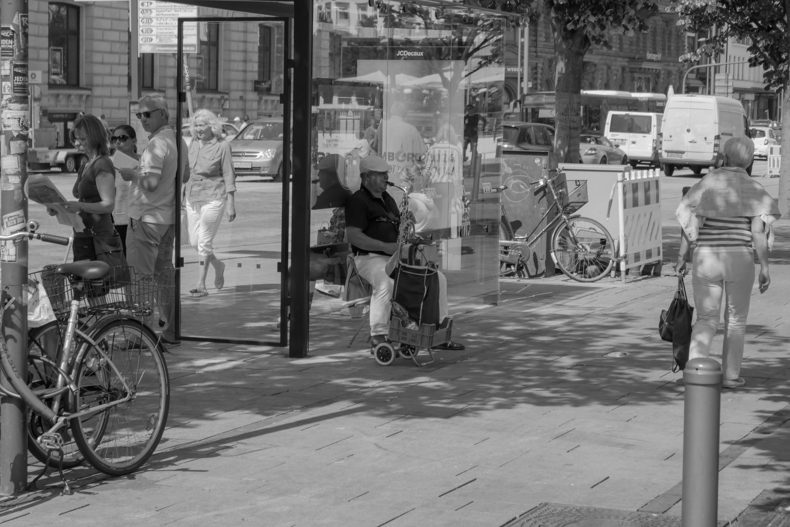 Man playing saxophone in the shade