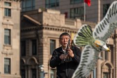 man with chinese kite