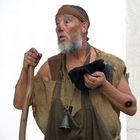 Man with leprosy... in a medieval fair