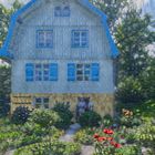 Mann mit roter Kappe vorm Münterhaus in Murnau