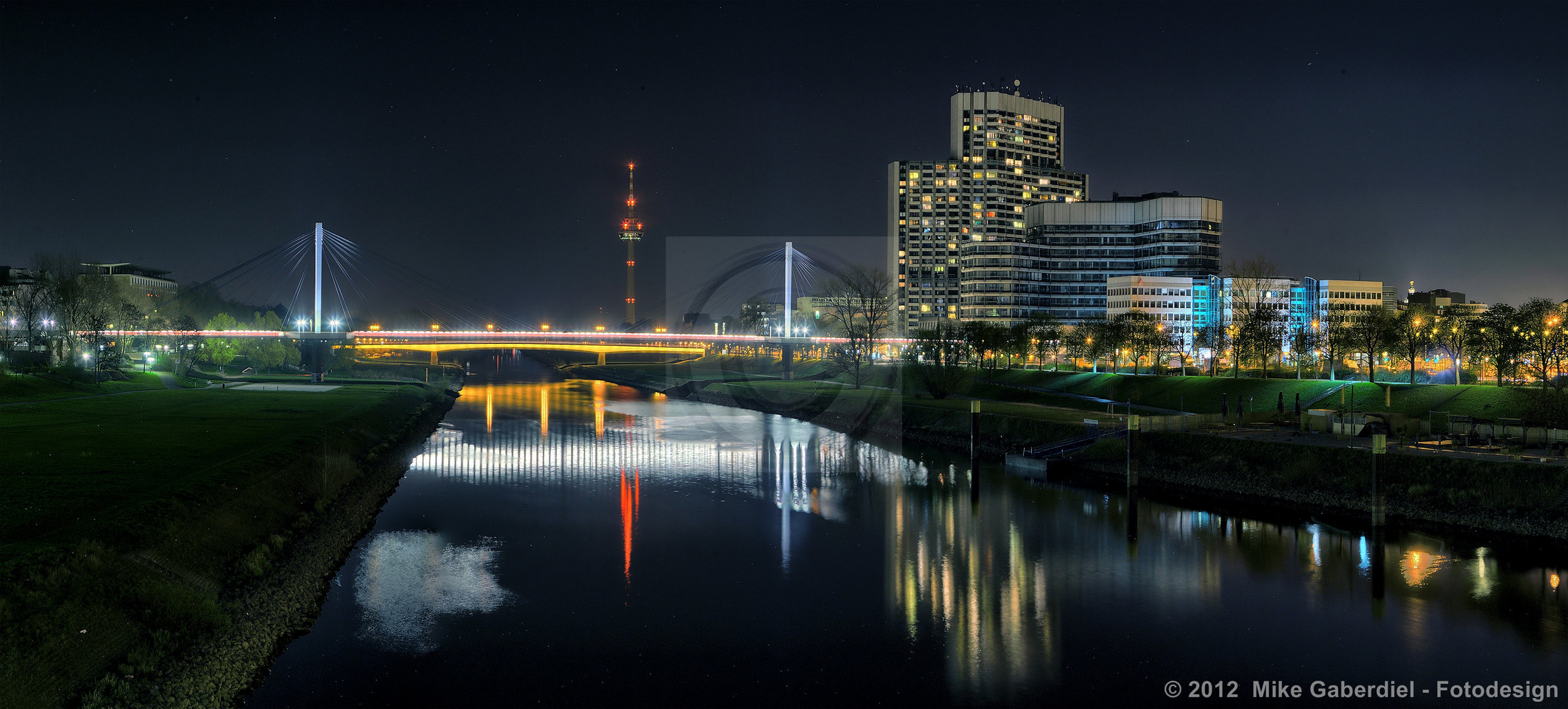 Mannheim, Germany, Night view of the Neckar with TV Tower and Collini Center