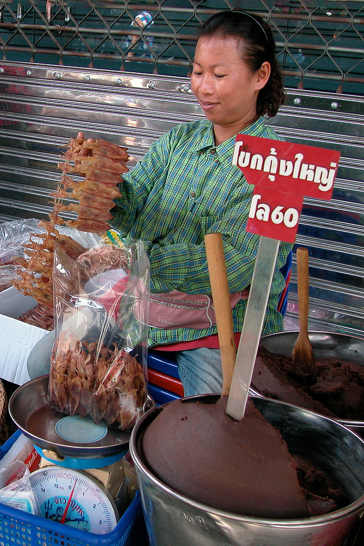 Market woman selling Kapi