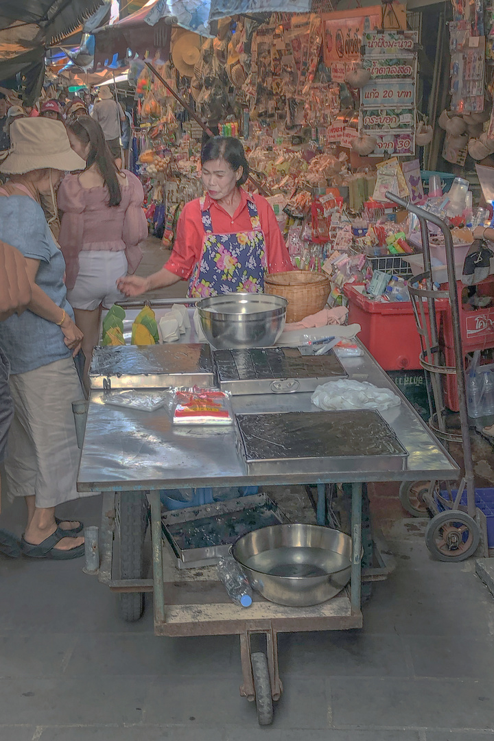 Market woman selling Khanom