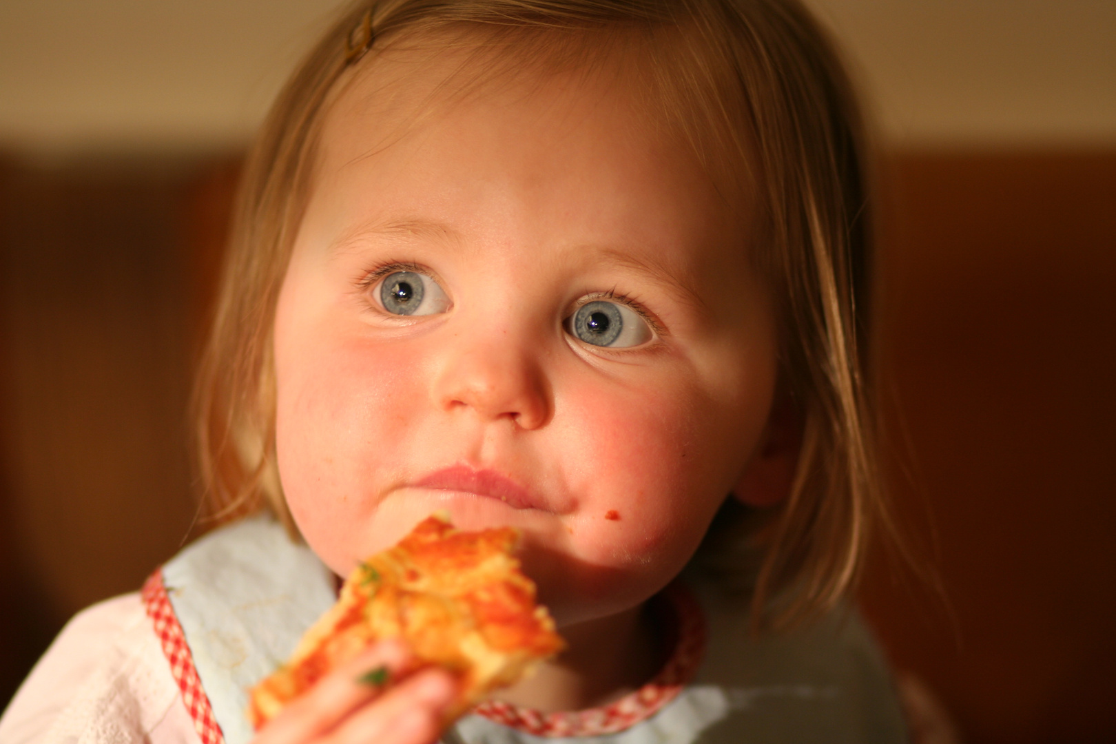 Mathilde eating pizza