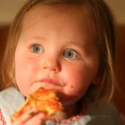 Mathilde eating pizza