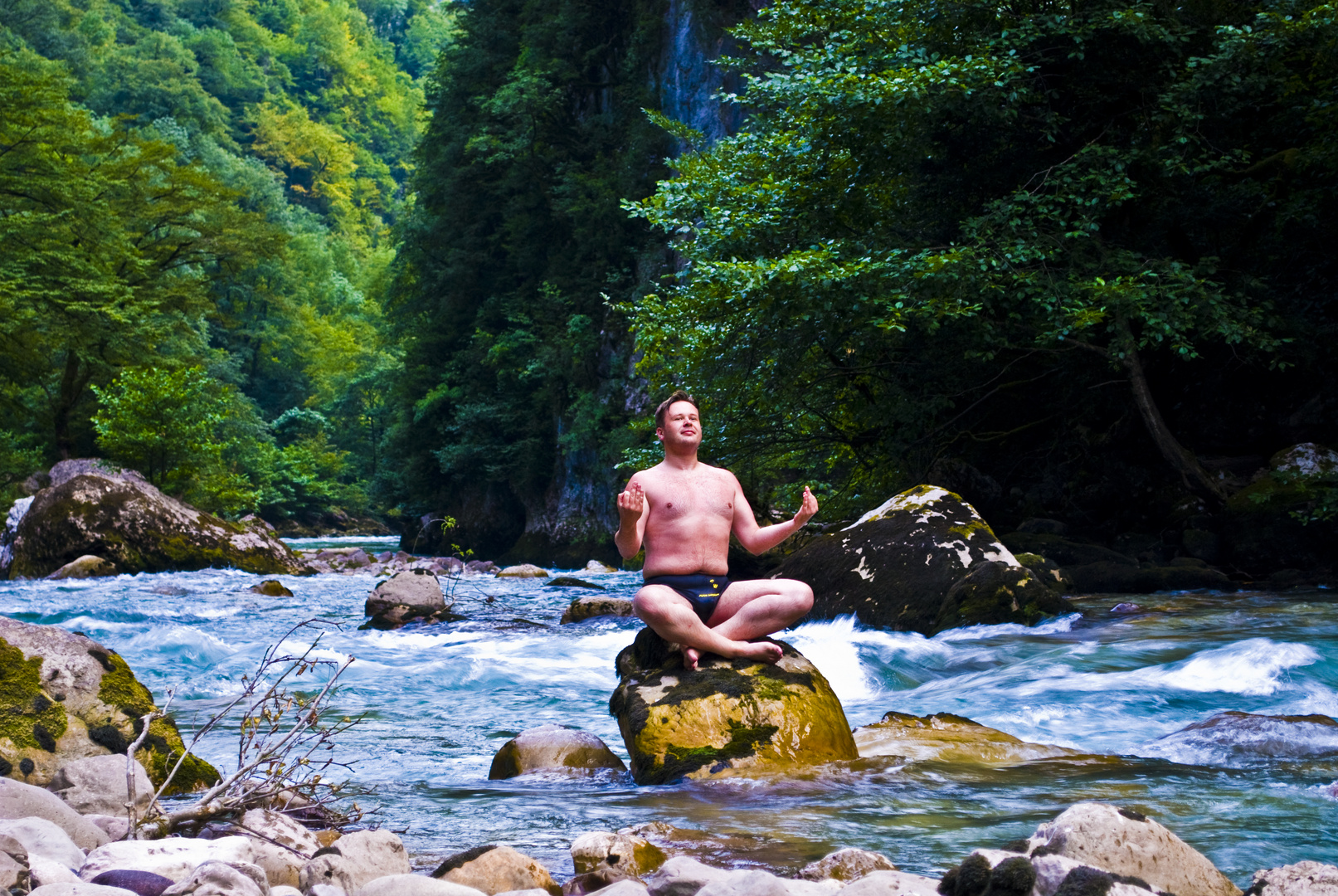 Meditation in the middle of a mountain river