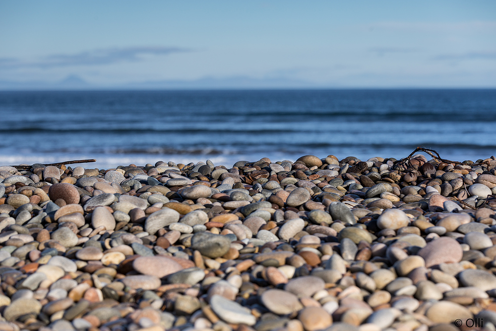 Meer, Kies, und Himmel