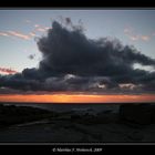 Meer, Strand, Wellen und Wolken