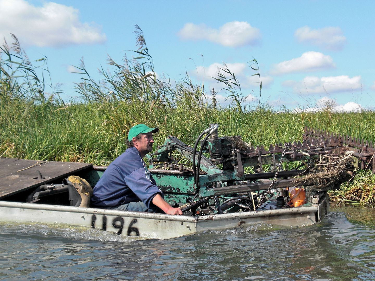 Men at work 46 - water reed cutter