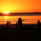 Menschen im Sonnenuntergang