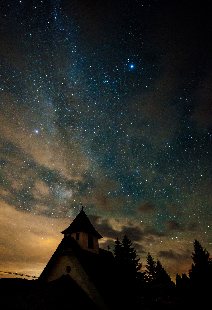 milky way behind clouds