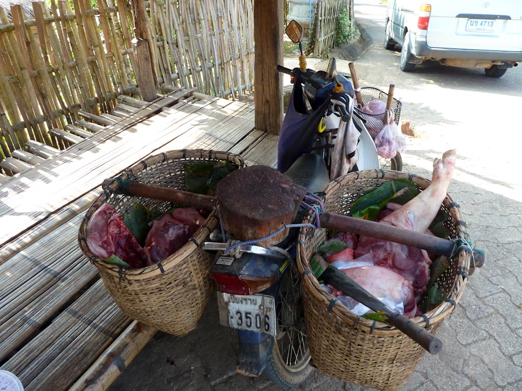 Mobile butcher in the Akha village (Chiang, Rai, Thailand)