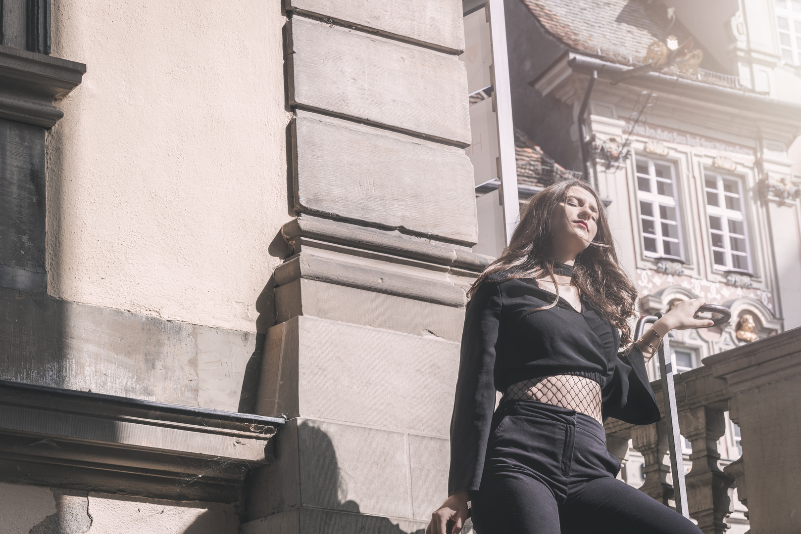 Modern dressed woman enjoying the sunlight