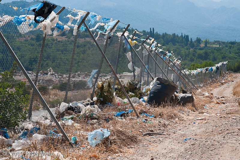 Modern prayer flags at the landfill (rubbish dump) on Samos island, Greece / July 2010