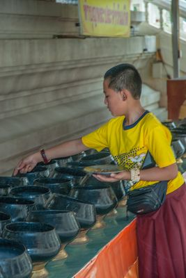Monk from Bhutan gifes offerings