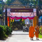 Monks enter a temple complex in Mae Sariang