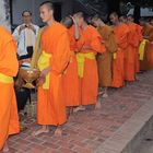 Monks get food donation in early morning