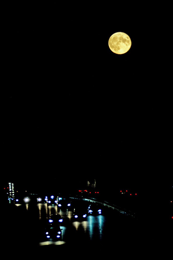 moon over busy street