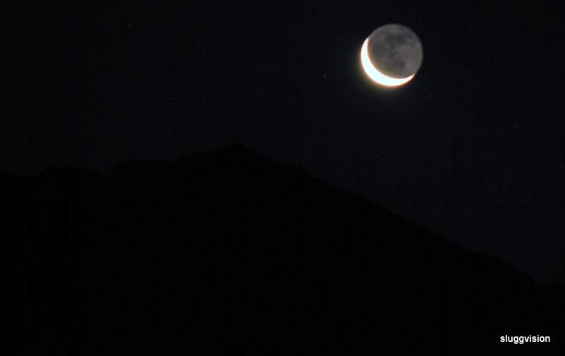 moon over mt baring in washington state