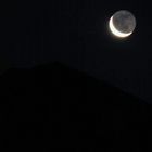 moon over mt baring in washington state