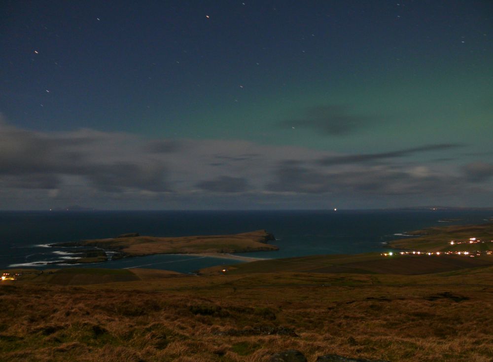 moonlit sky with faint northern lights