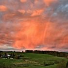 Morgenglühen mit rotem Regenbogen