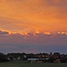 Morgenrot und angestrahlte Wolken über Meusegast...