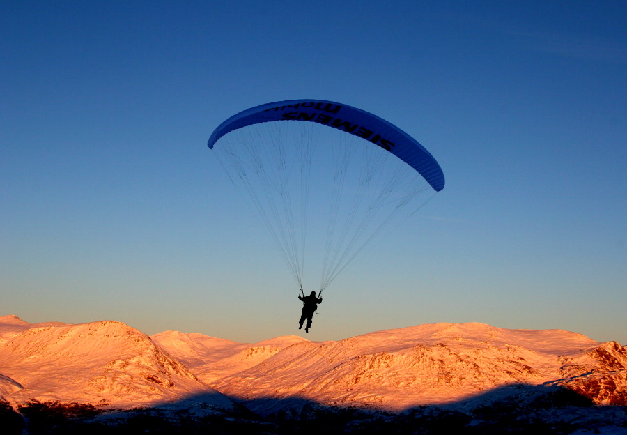 Morning flight over golden mountain