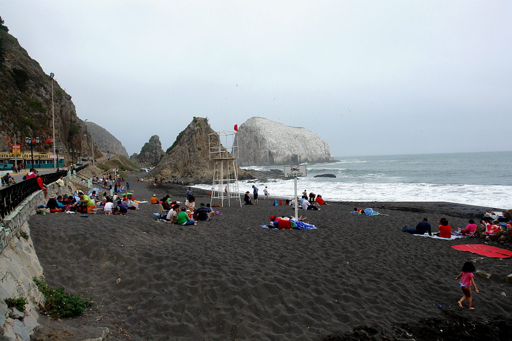 morning haze in a black sanded beach