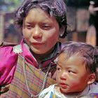 Mother and son join the Paro Tsechu festival