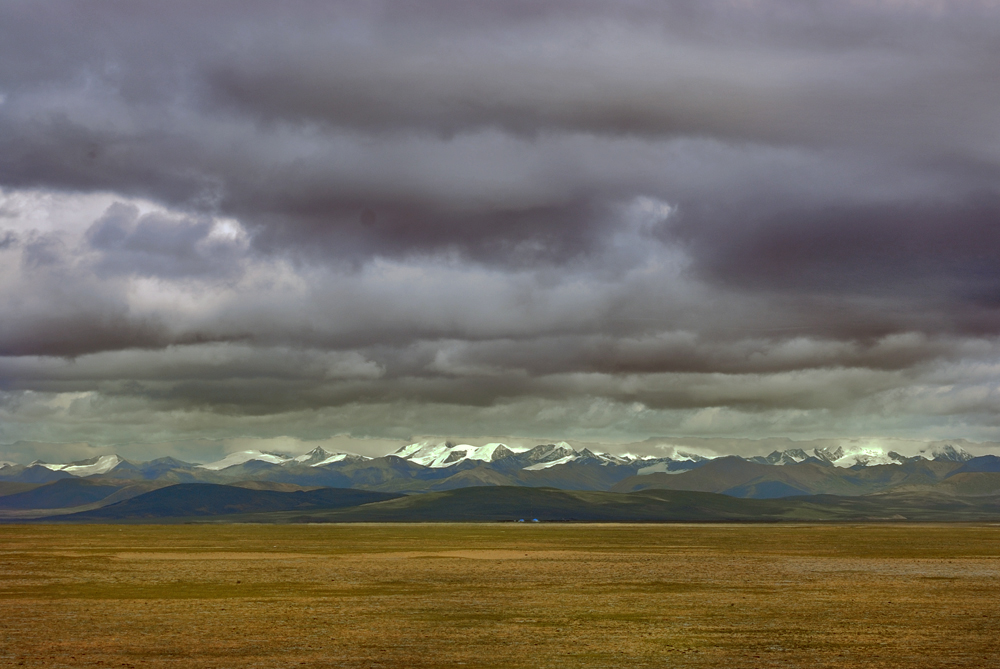 Mountain range under heavy clouds