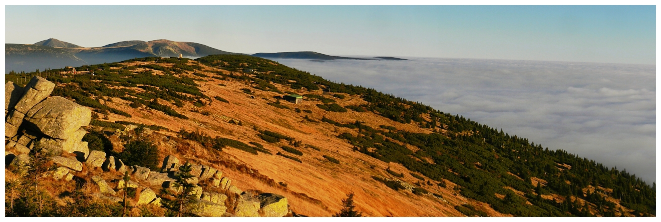 Mountains above low cloud