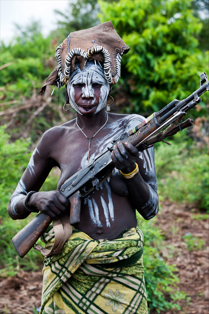 [ Mursi Tribe Woman with Rifle ]