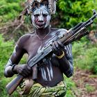 [ Mursi Tribe Woman with Rifle ]