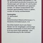 Museumsschild zu Fenstergitter