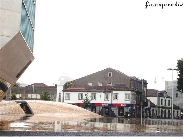 Music House - reflection on wet stone pavement