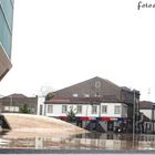 Music House - reflection on wet stone pavement