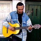 Musician with a shy pigeon:)