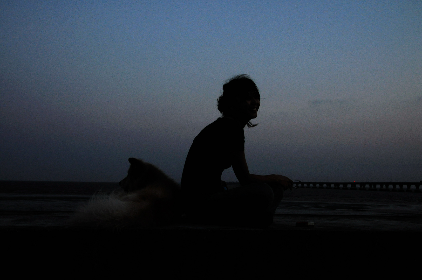 My GF and our poppy at seaside, nightfall