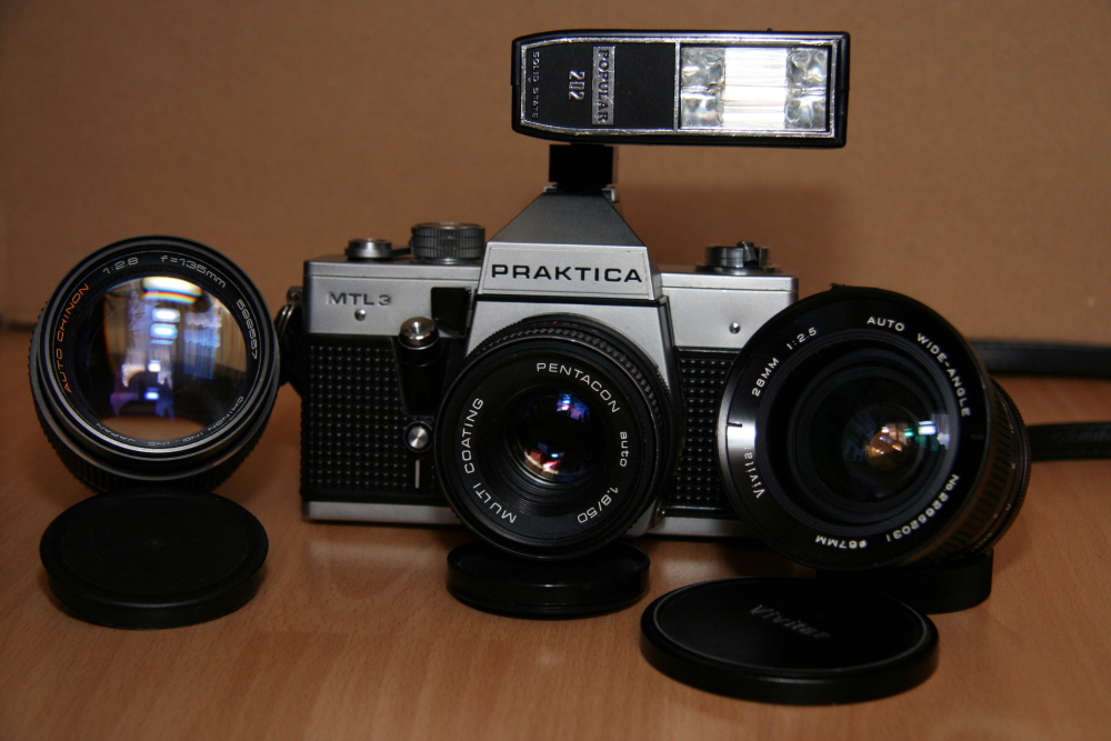 my old practika mtl3 with lenses and flash light.