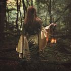 Mysterious woman in fairy forest 