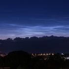 Nachleuchtende Wolken über der Stadt