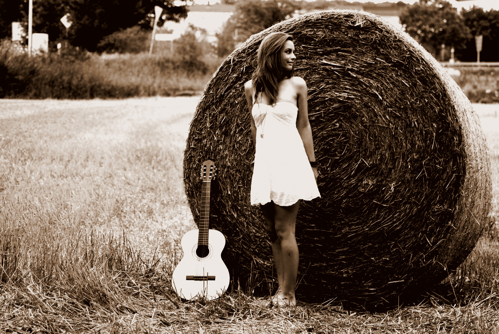 nature is breathing on her and her guitar.