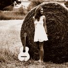 nature is breathing on her and her guitar.