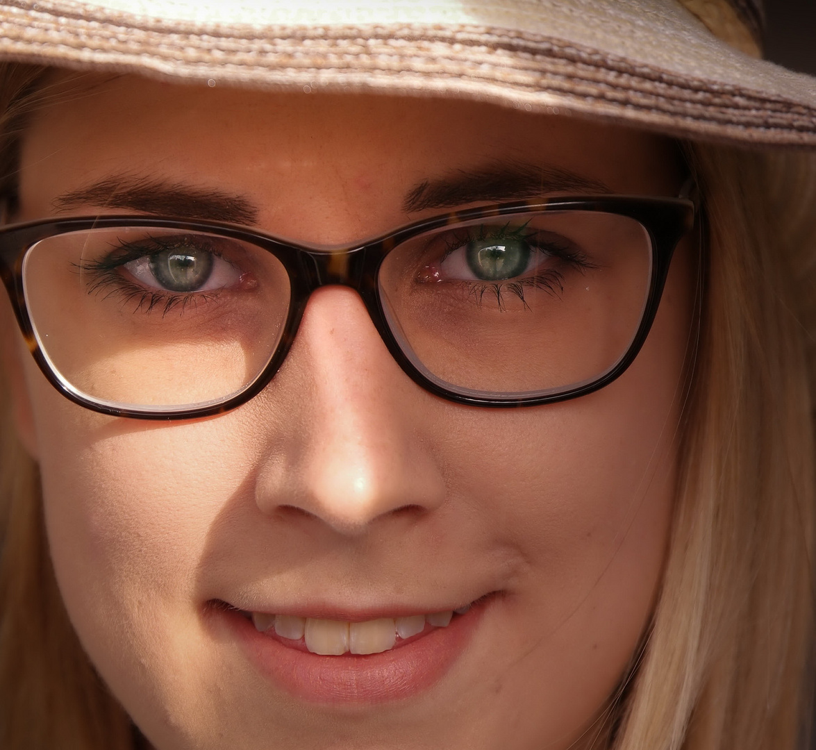 Nena sunlight with glasses and stunning green eyes