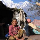 Nepalese Woman Drying Rice